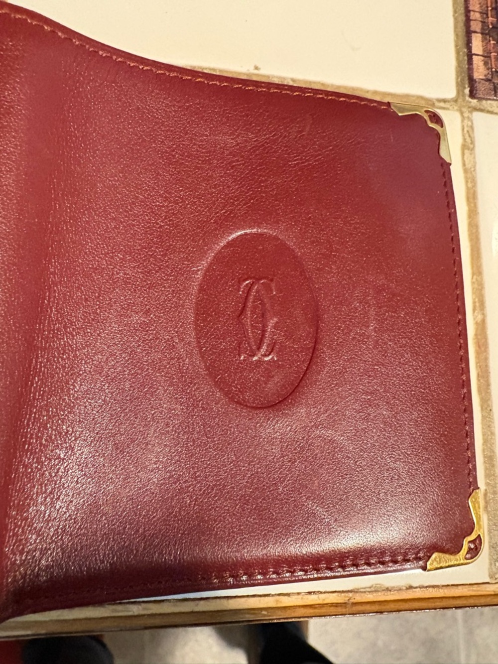 Vintage Cartier Burgundy Leather Bifold Wallet with Gold-Tone Corners